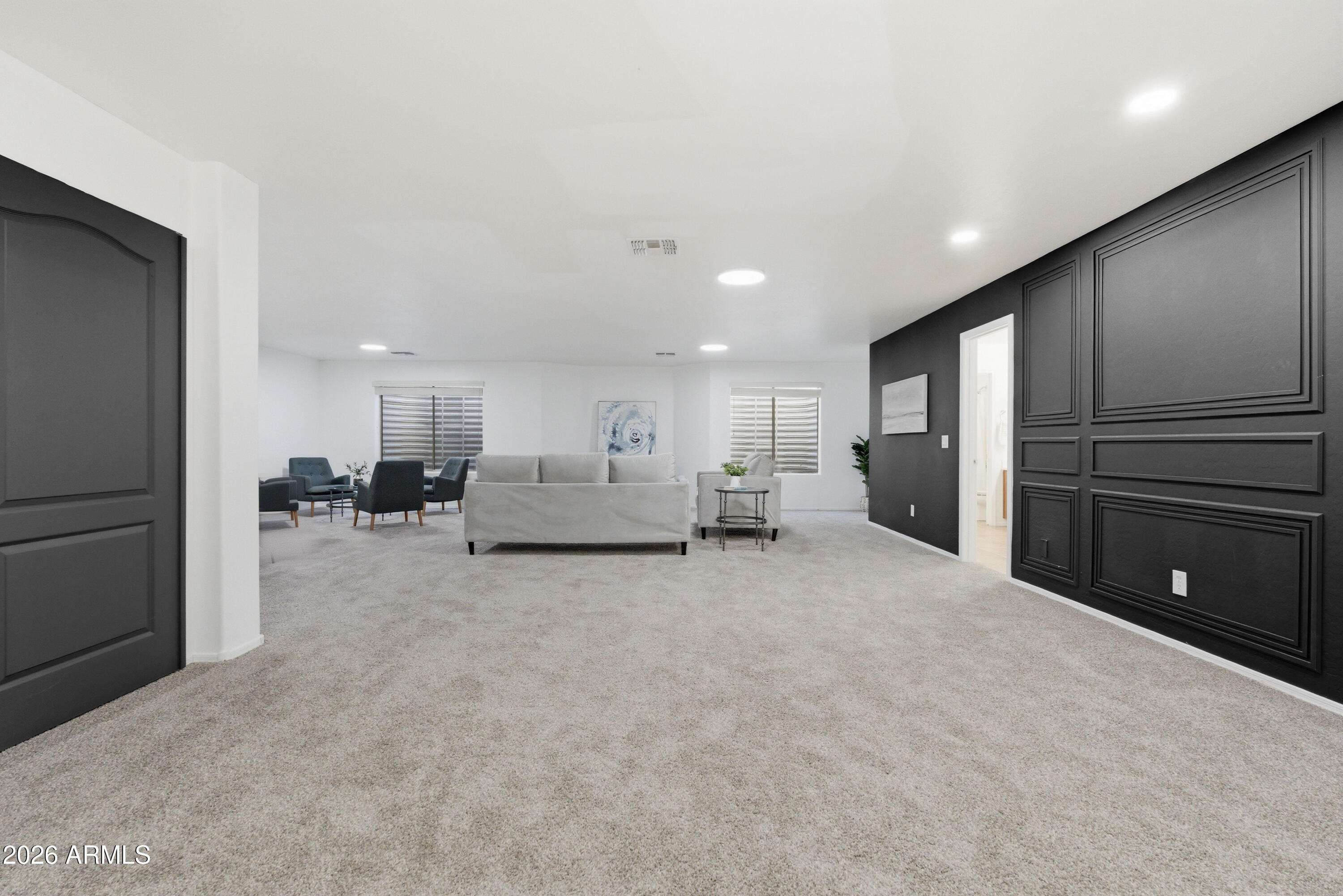 4140 East Claxton Avenue Gilbert, AZ 85297 - Photo 52 of 117 a view of a livingroom with furniture and a ceiling fan