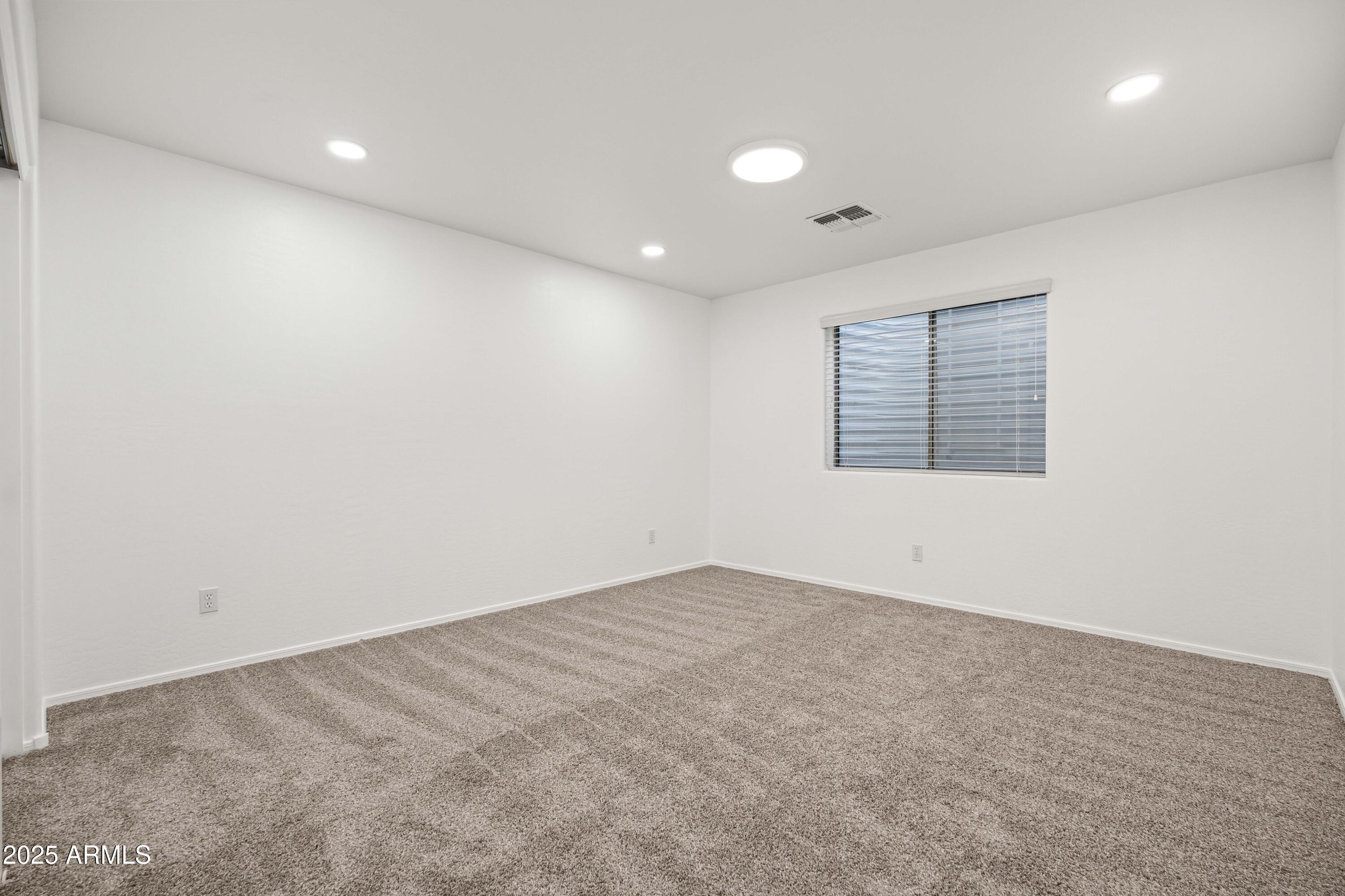 4140 East Claxton Avenue Gilbert, AZ 85297 - Photo 60 of 117 an empty room with a empty space & window