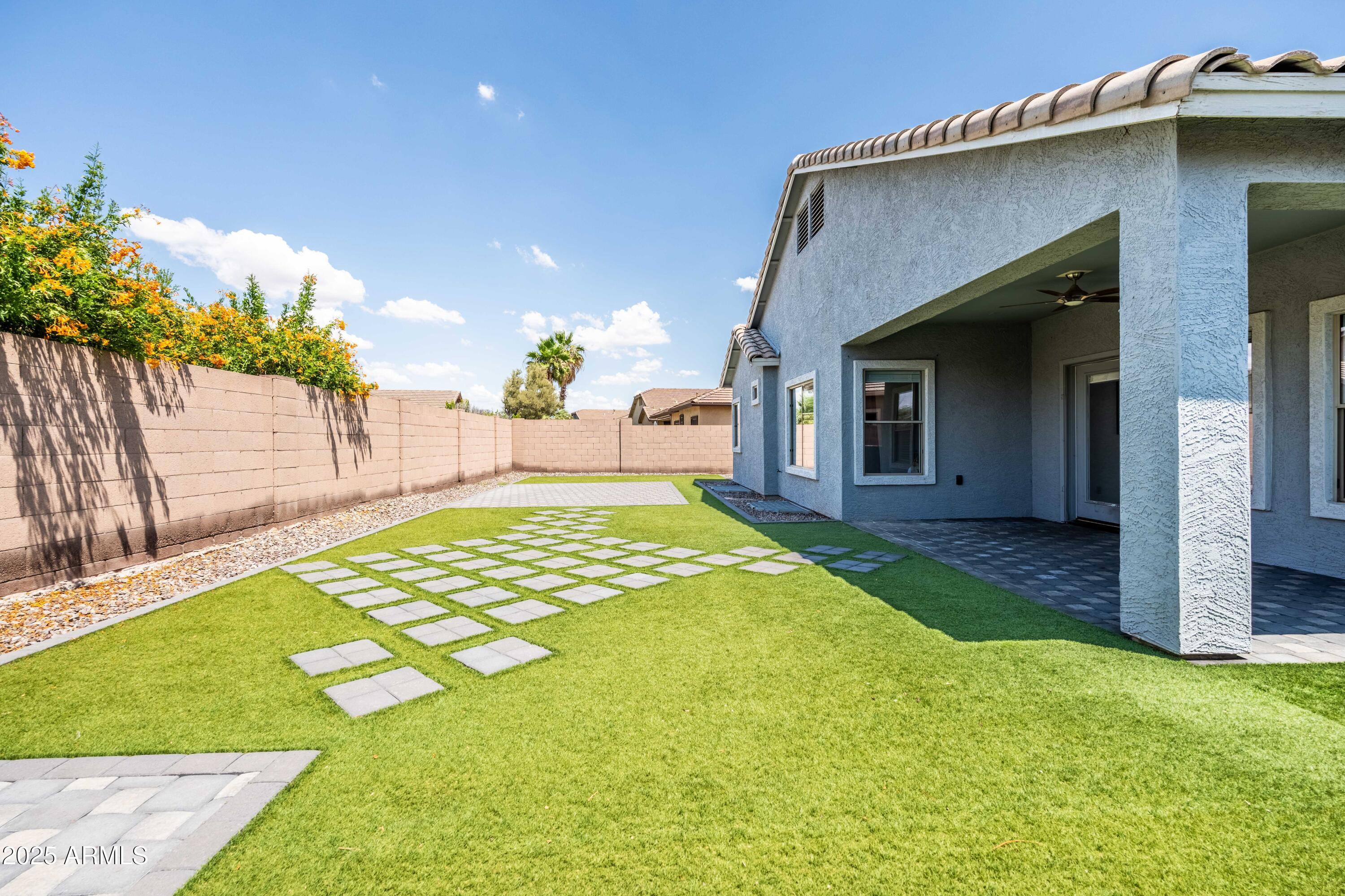 4140 East Claxton Avenue Gilbert, AZ 85297 - Photo 69 of 117 a view of a house with a yard