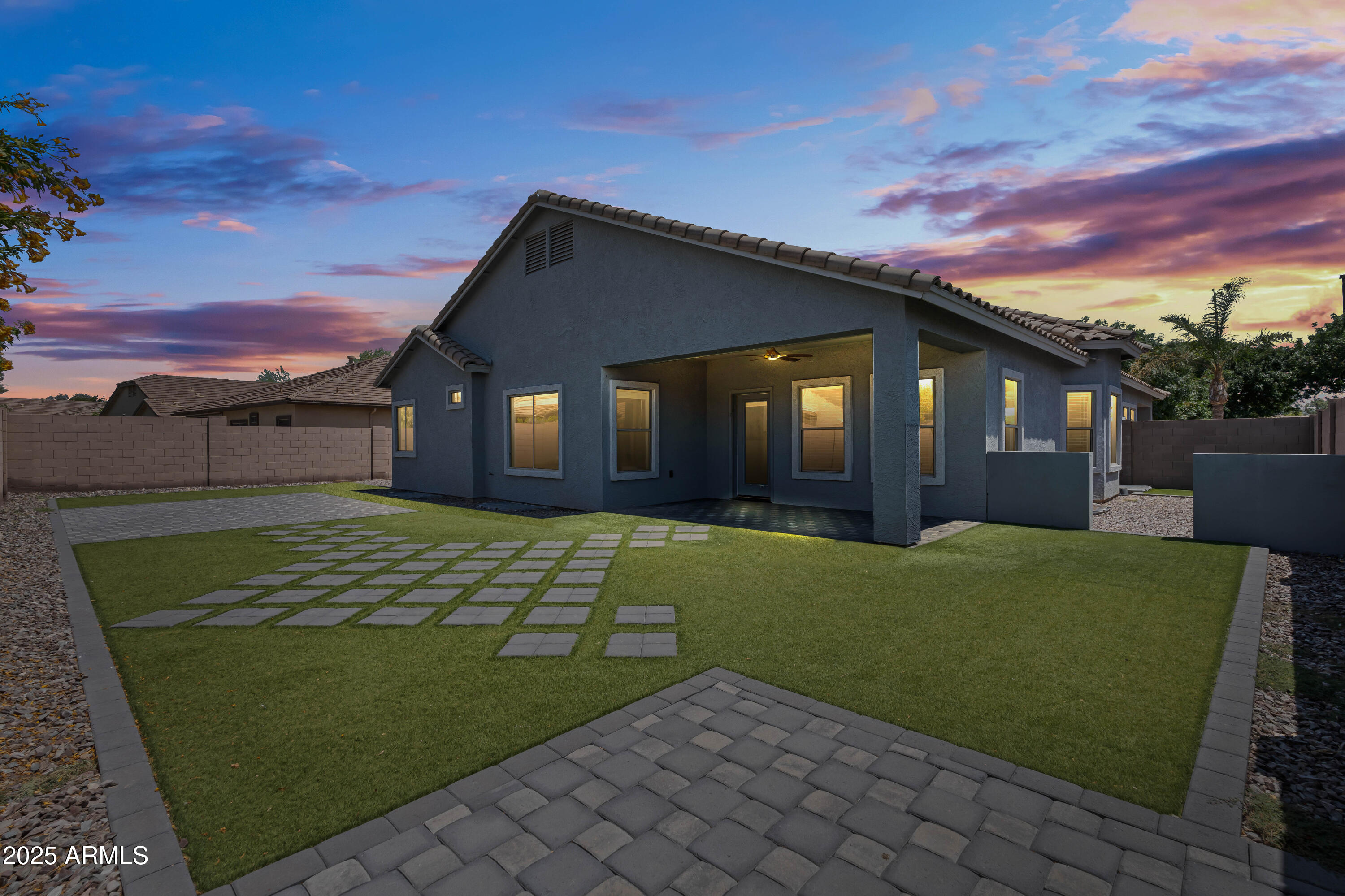 4140 East Claxton Avenue Gilbert, AZ 85297 - Photo 71 of 117 a front view of a house with a garden