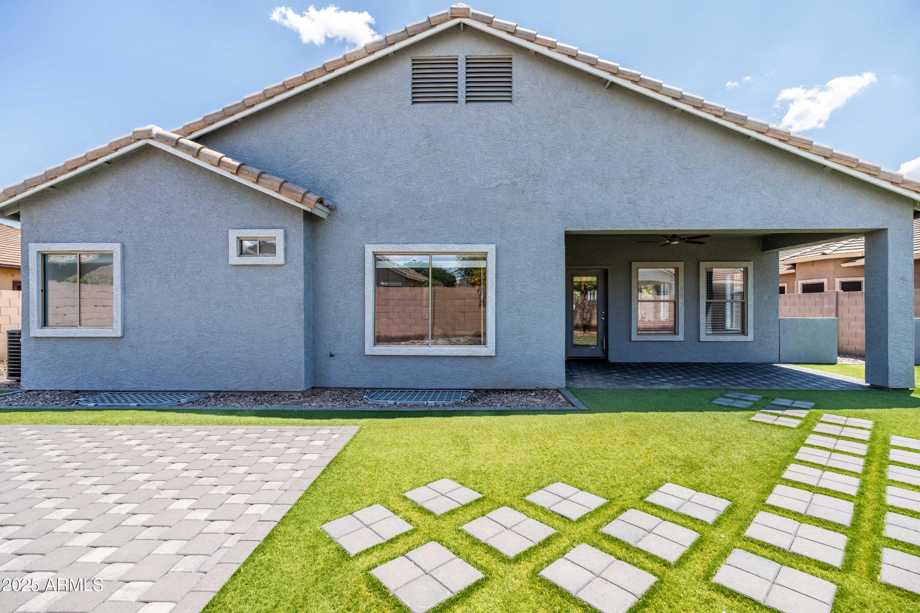 4140 East Claxton Avenue Gilbert, AZ 85297 - Photo 73 of 117 a front view of a house with a yard
