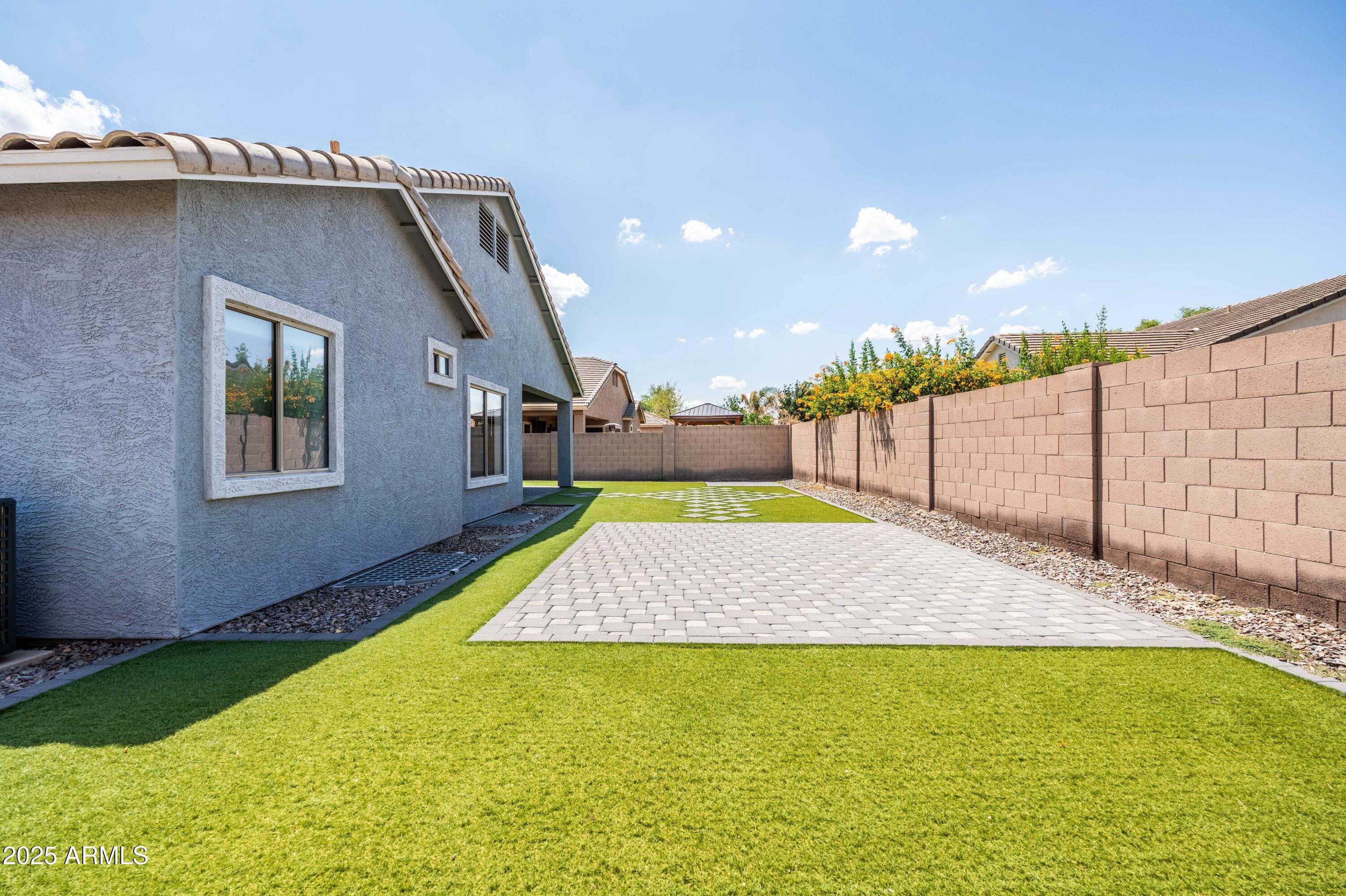 4140 East Claxton Avenue Gilbert, AZ 85297 - Photo 75 of 117 a view of swimming pool with a yard