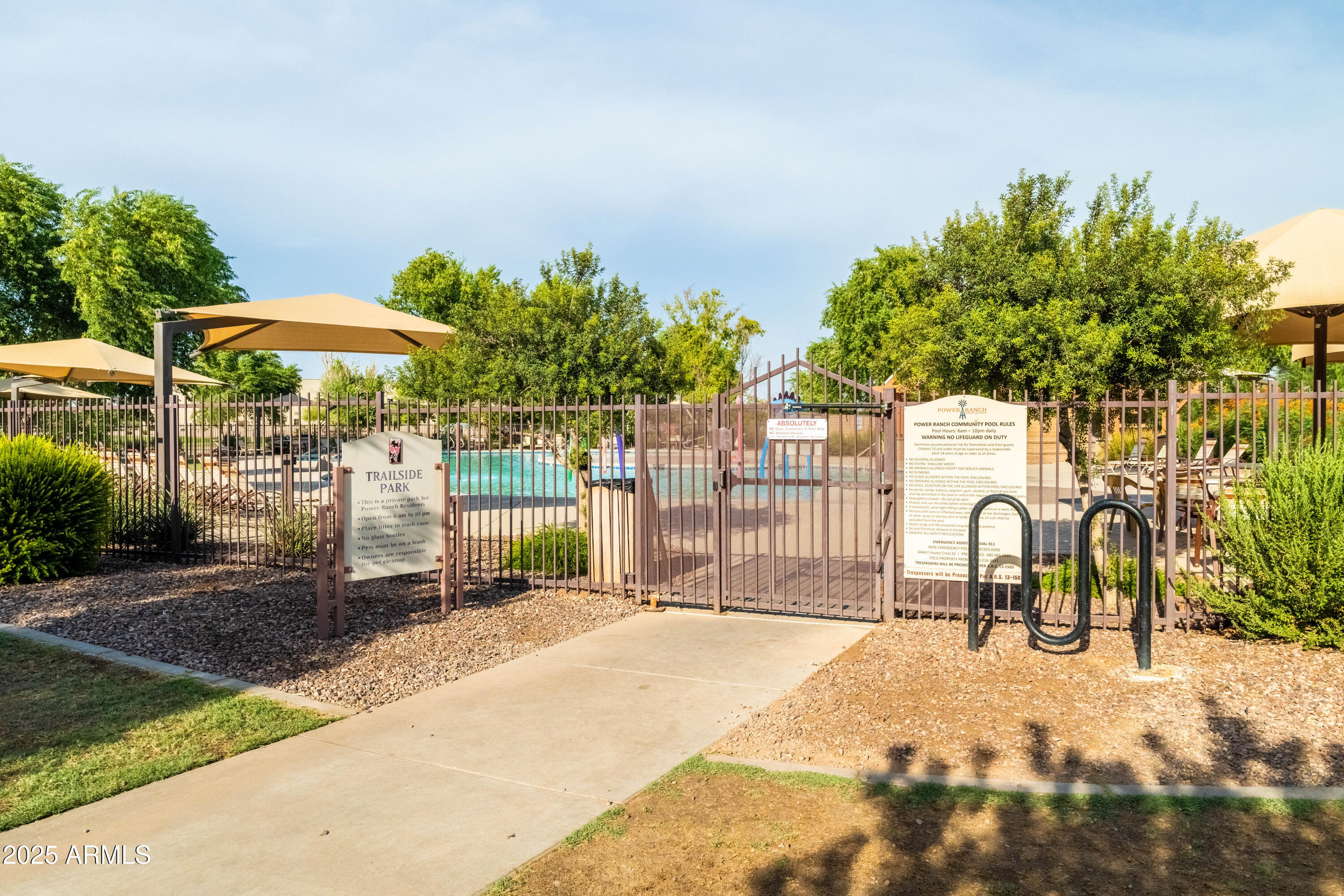 4140 East Claxton Avenue Gilbert, AZ 85297 - Photo 89 of 112 a backyard of a house with table and chairs