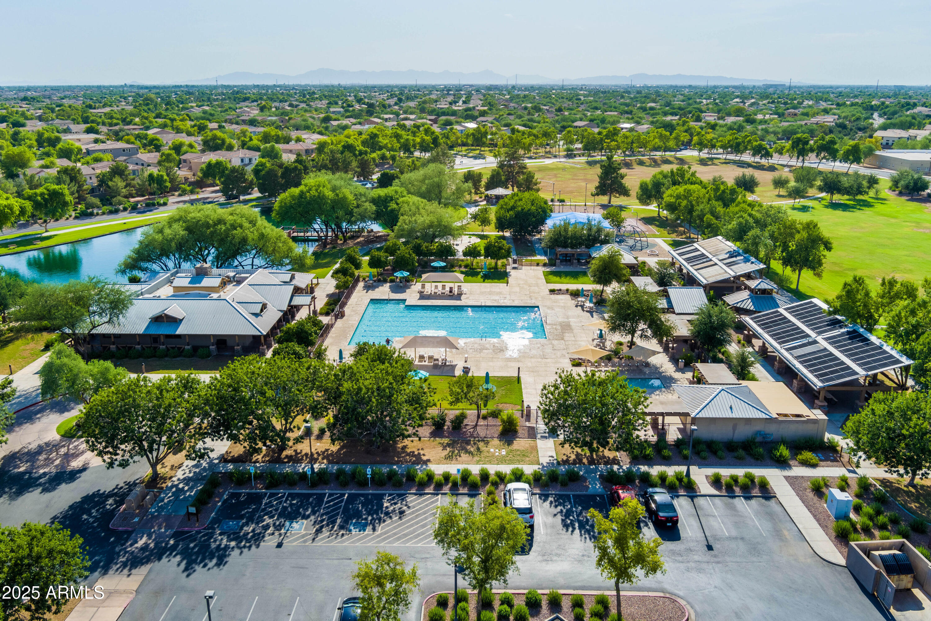 4140 East Claxton Avenue Gilbert, AZ 85297 - Photo 95 of 112 an aerial view of residential houses with outdoor space and lake view