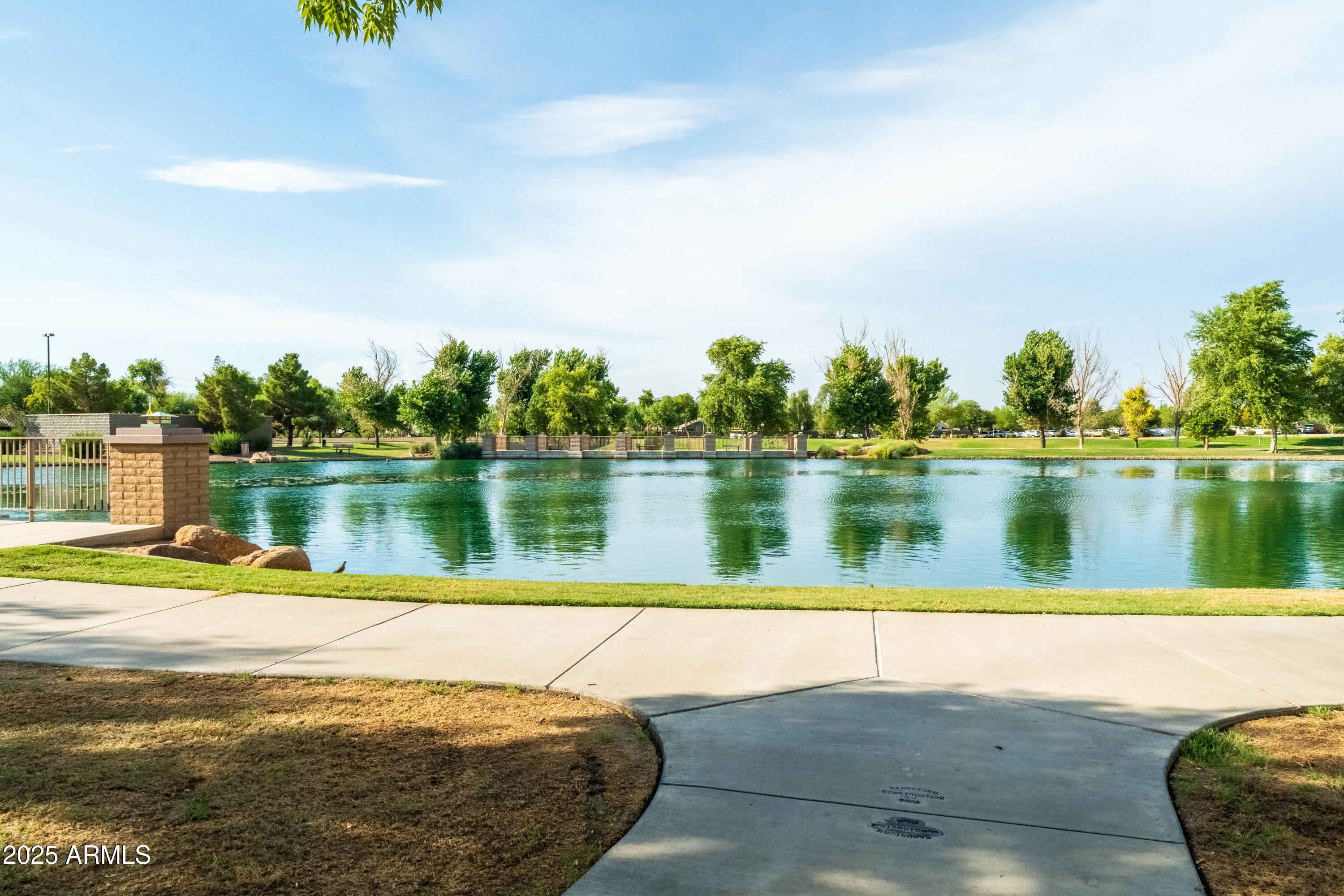 4140 East Claxton Avenue Gilbert, AZ 85297 - Photo 98 of 117 a view of a lake with houses in the background