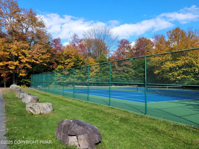 a view of a street with a building in the background