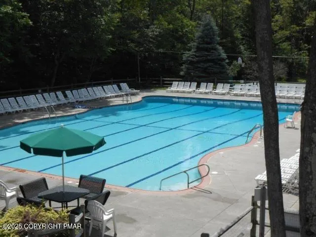 a view of a chairs and table in the patio