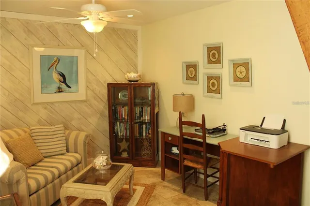 a view of a dining room with furniture and window