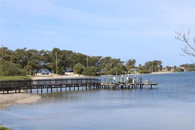 a view of a door and chair in the patio