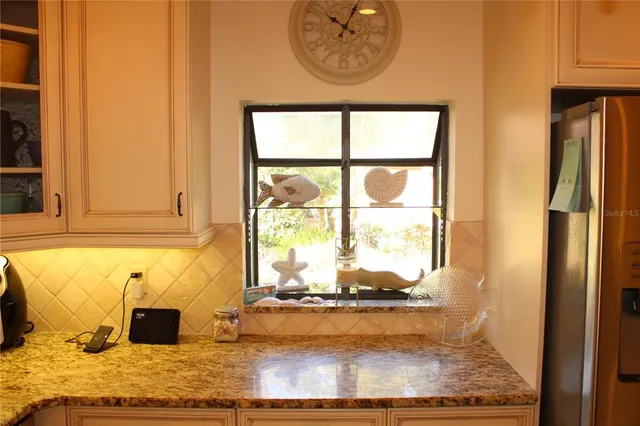 a view of a living room with a fireplace