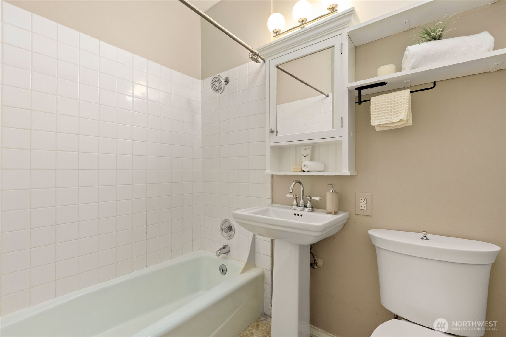 615 Boren Avenue, Unit 6 Seattle, WA 98104 - Photo 15 of 26 a bathroom with a sink a toilet and shower