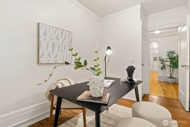 a view of a dining room with furniture and wooden floor