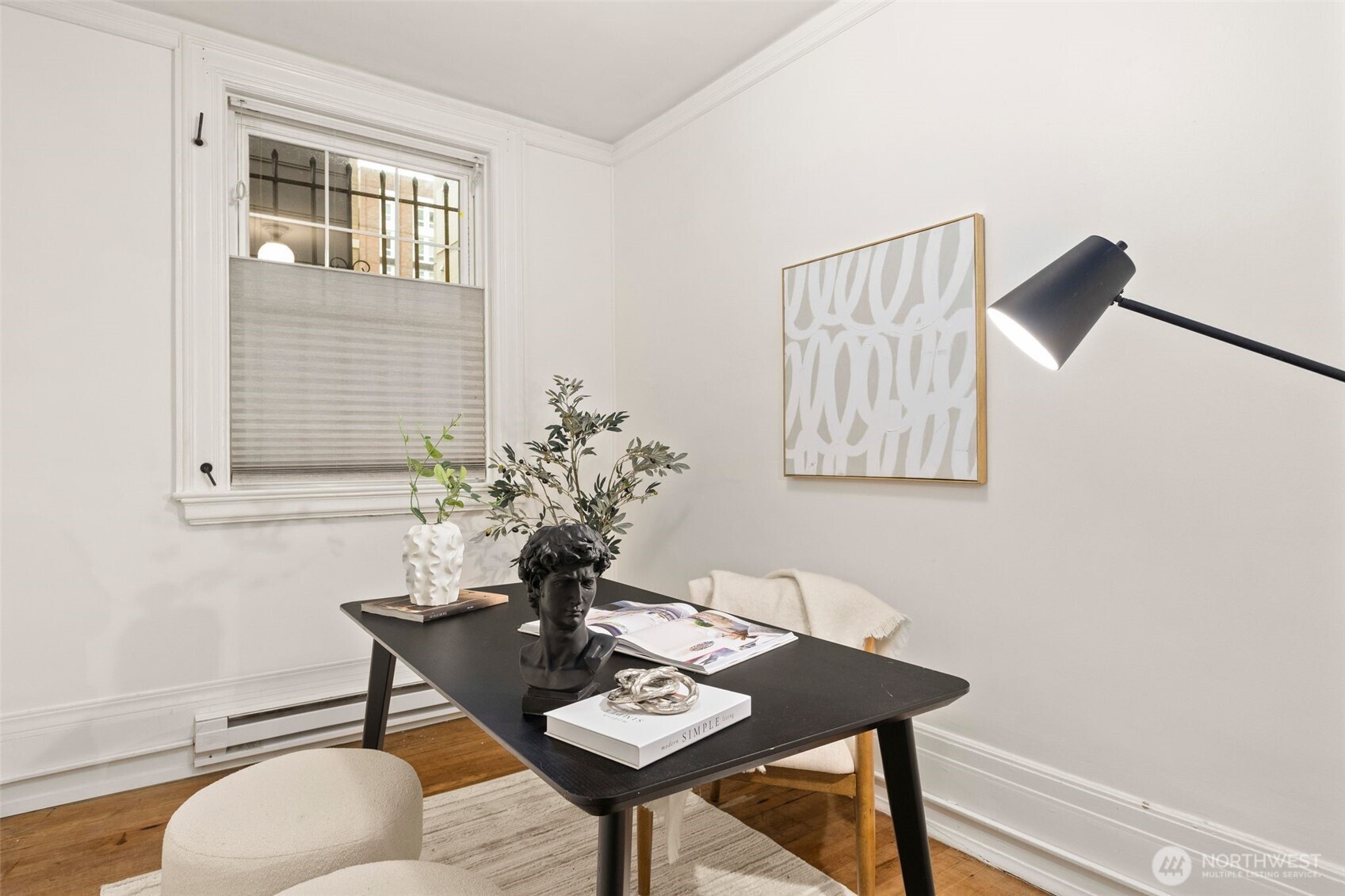 615 Boren Avenue, Unit 6 Seattle, WA 98104 - Photo 17 of 26 a dining room with furniture and window