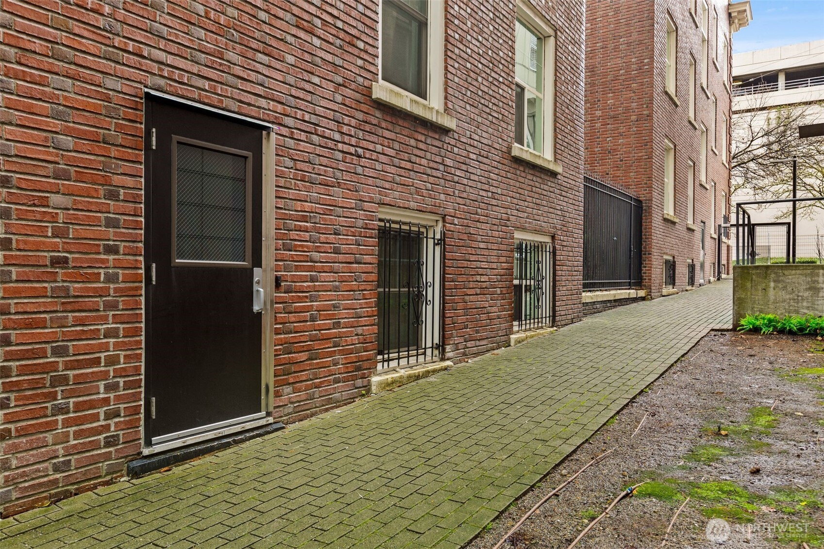 615 Boren Avenue, Unit 6 Seattle, WA 98104 - Photo 22 of 26 a view of a brick house with a large window