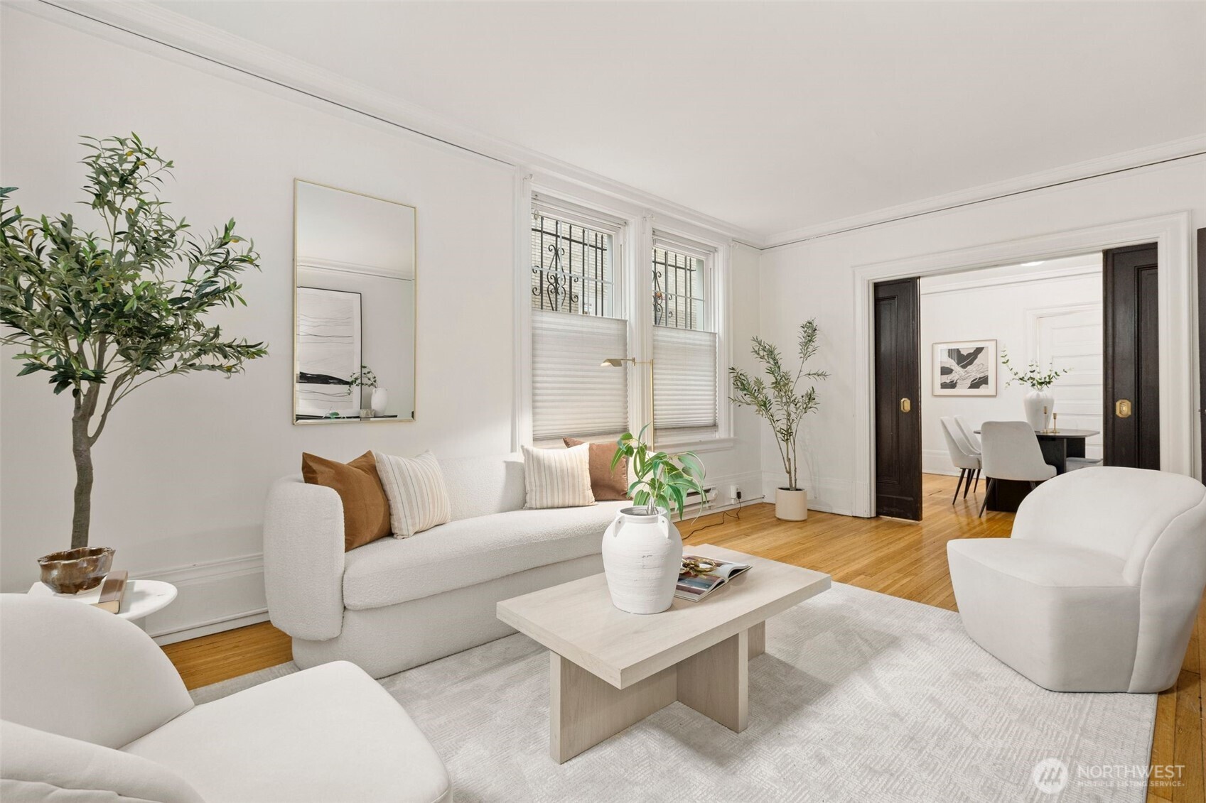 615 Boren Avenue, Unit 6 Seattle, WA 98104 - Photo 4 of 26 a living room with furniture and a potted plant