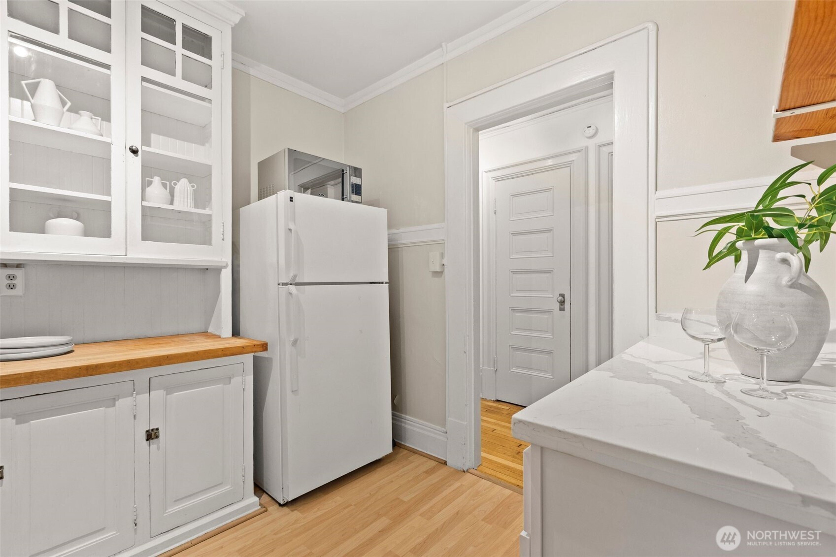 615 Boren Avenue, Unit 6 Seattle, WA 98104 - Photo 10 of 26 a white refrigerator freezer sitting in a kitchen