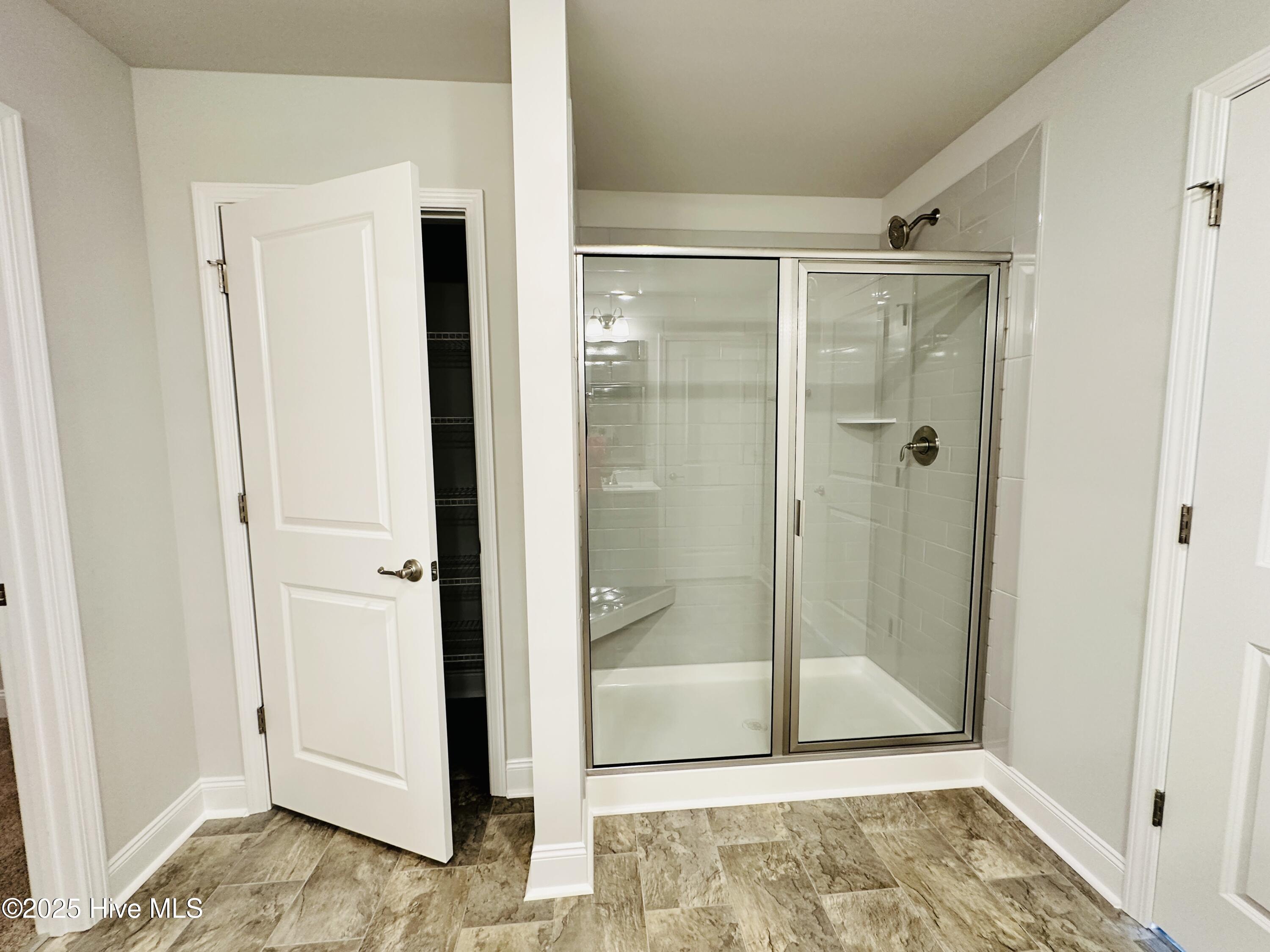 3982 Fletcher Road, Unit LOT 180 Bailey, NC 27807 - Photo 21 of 28 Primary Shower & Linen Closet
