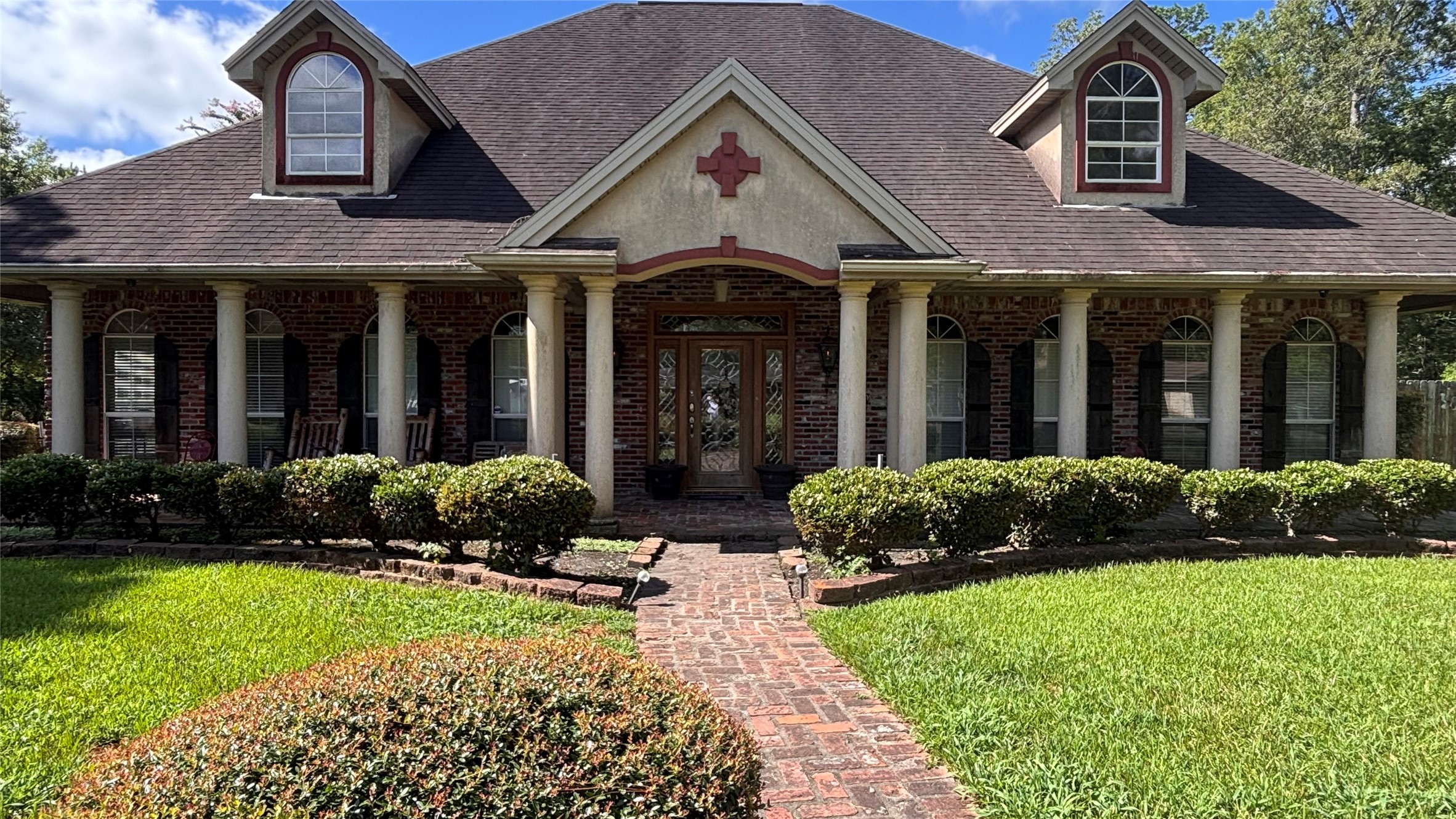 4515 Ridgewood Avenue Beaumont, TX 77708 - Photo 3 of 5 a view of a brick house with a yard and plants