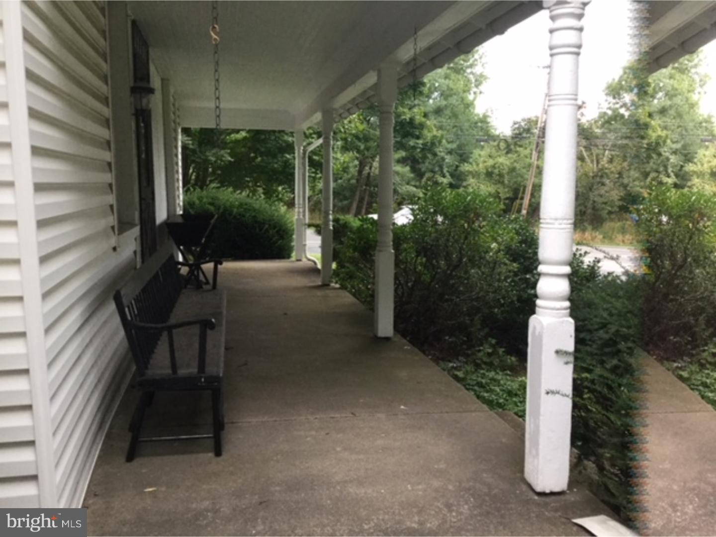 740 Upper Stump Road Chalfont, PA 18914 - Photo 3 of 21 a bench sitting in front of a building