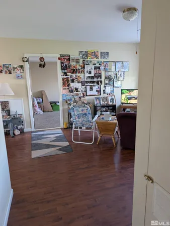 a view of livingroom with dining room and wooden floor