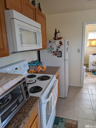 a kitchen with a stove and a microwave