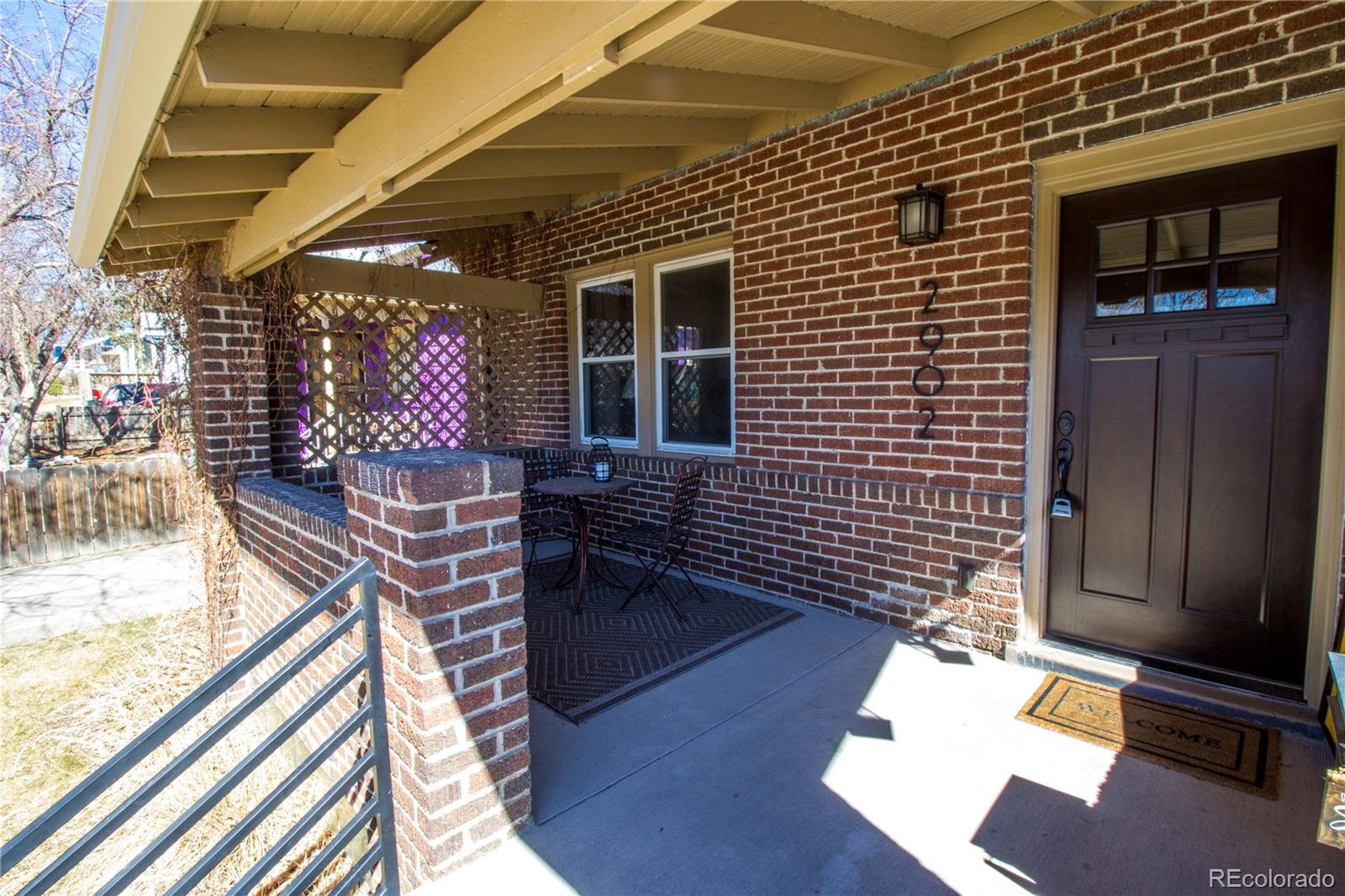 2902 Eaton Street Wheat Ridge, CO 80214 - Photo 3 of 34 a patio with table and chairs