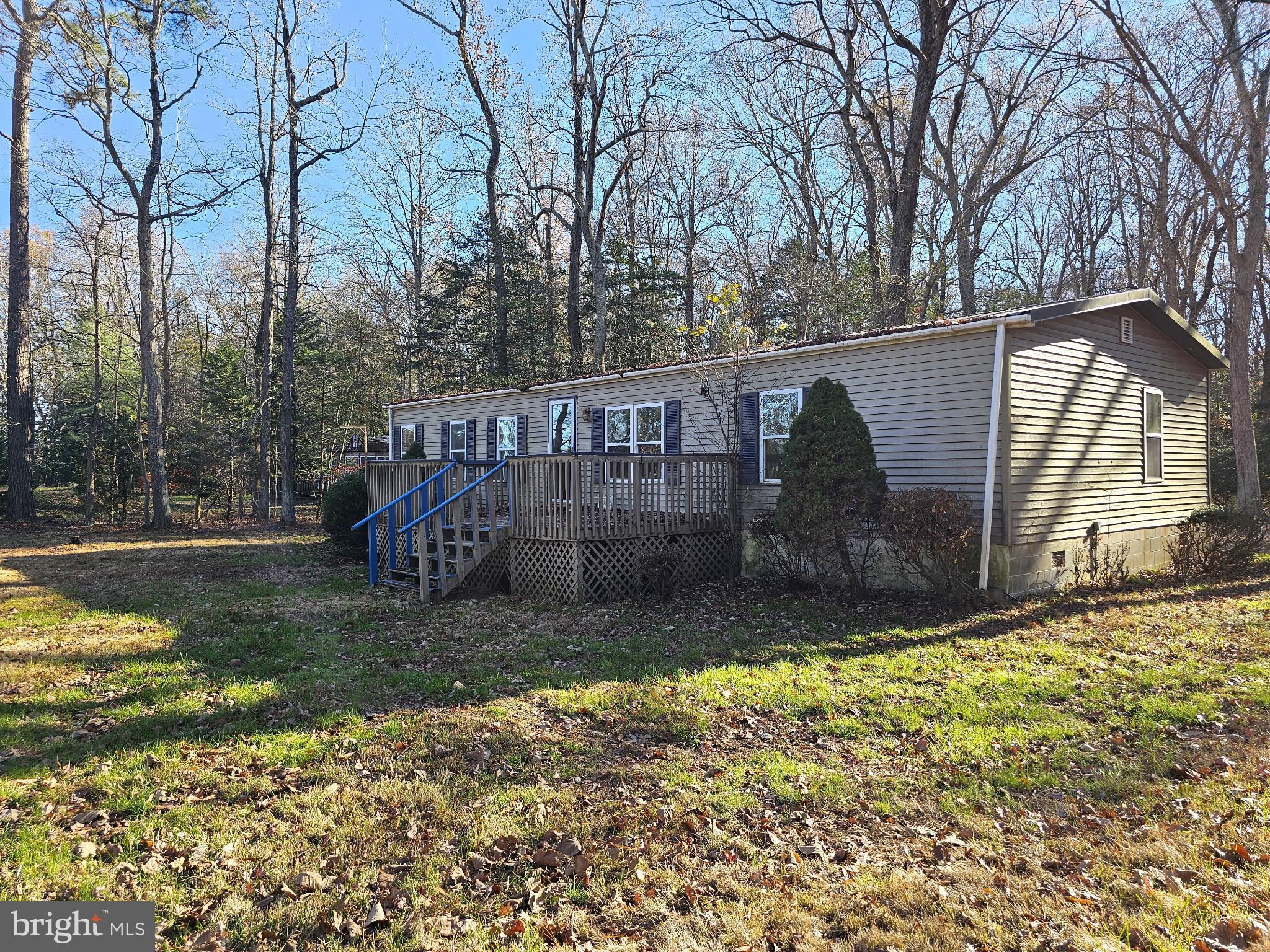 7350 Park Brown Road Harrington, DE 19952 - Photo 1 of 8 a view of a house with backyard and trees