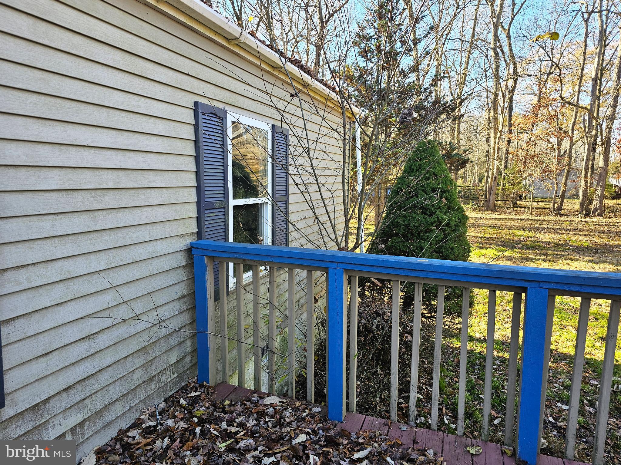 7350 Park Brown Road Harrington, DE 19952 - Photo 5 of 8 a view of a porch with a wooden fence