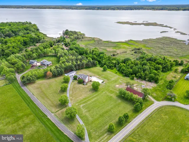 a view of yard with swimming pool and green space