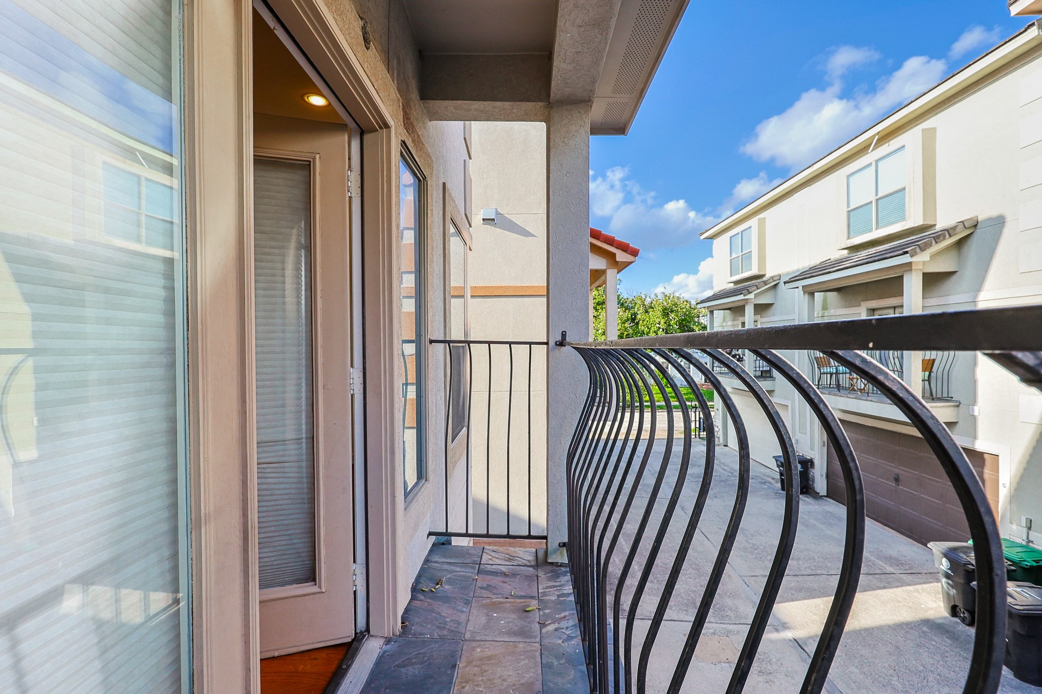 2540 Prospect Street, Unit C Houston, TX 77004 - Photo 30 of 31 a view of staircase with railing and a rug