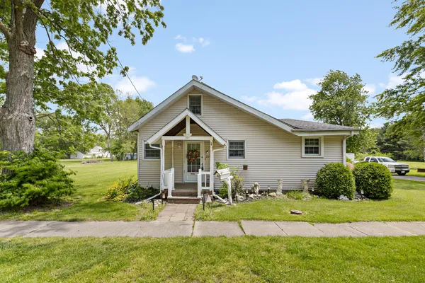 a front view of a house with garden