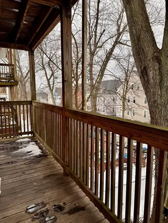 a view of balcony with wooden floor