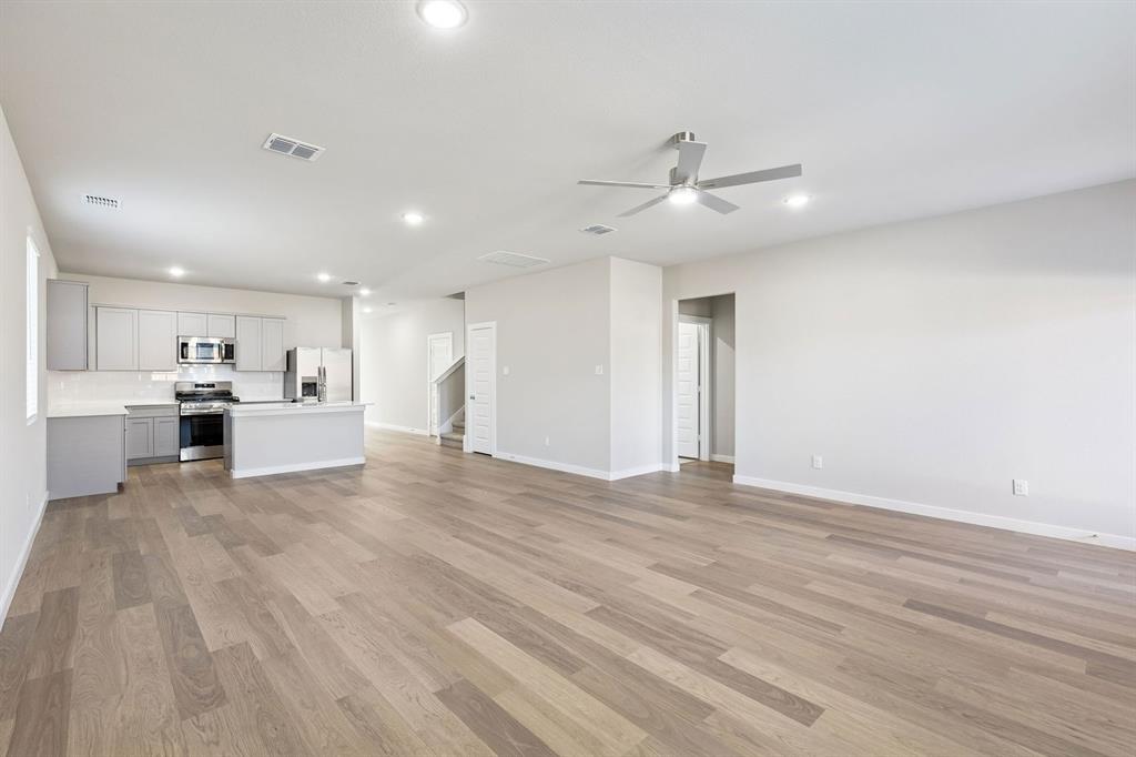 1145 Del Rio Drive Lavon, TX 75166 - Photo 17 of 35 Open First Floor in the Haylee home plan by Trophy Signature Homes - REPRESENTATIVE PHOTO