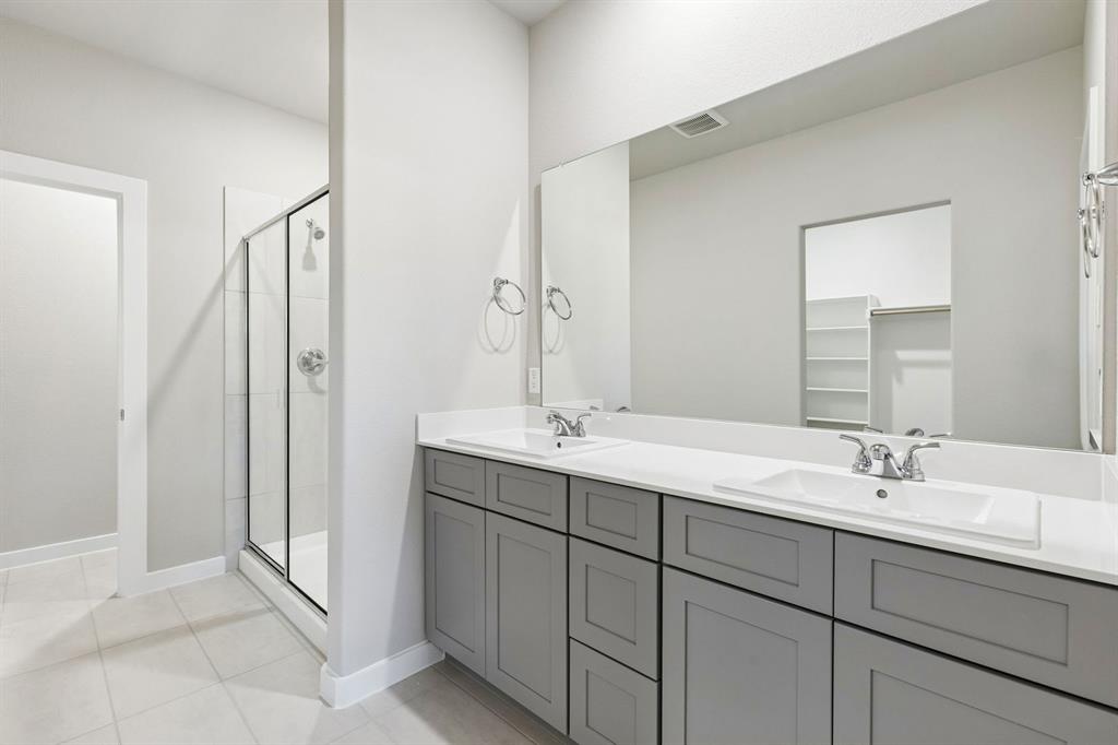 1145 Del Rio Drive Lavon, TX 75166 - Photo 23 of 35 Primary Bathroom in the Haylee home plan by Trophy Signature Homes - REPRESENTATIVE PHOTO