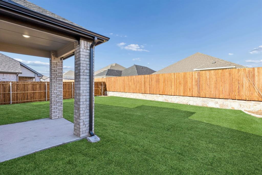 1145 Del Rio Drive Lavon, TX 75166 - Photo 33 of 35 Covered Patio in the Haylee home plan by Trophy Signature Homes - REPRESENTATIVE PHOTO