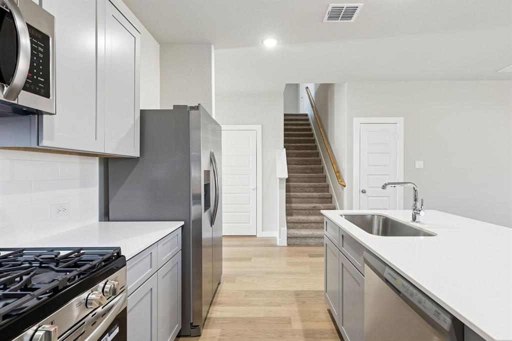 1145 Del Rio Drive Lavon, TX 75166 - Photo 7 of 35 Kitchen in the Haylee home plan by Trophy Signature Homes - REPRESENTATIVE PHOTO