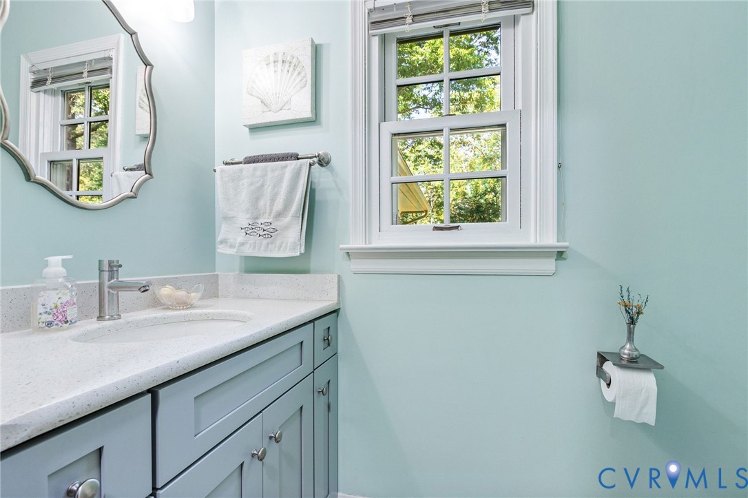 5700 Elfinwood Road Chester, VA 23831 - Photo 17 of 38 a bathroom with a sink and a window
