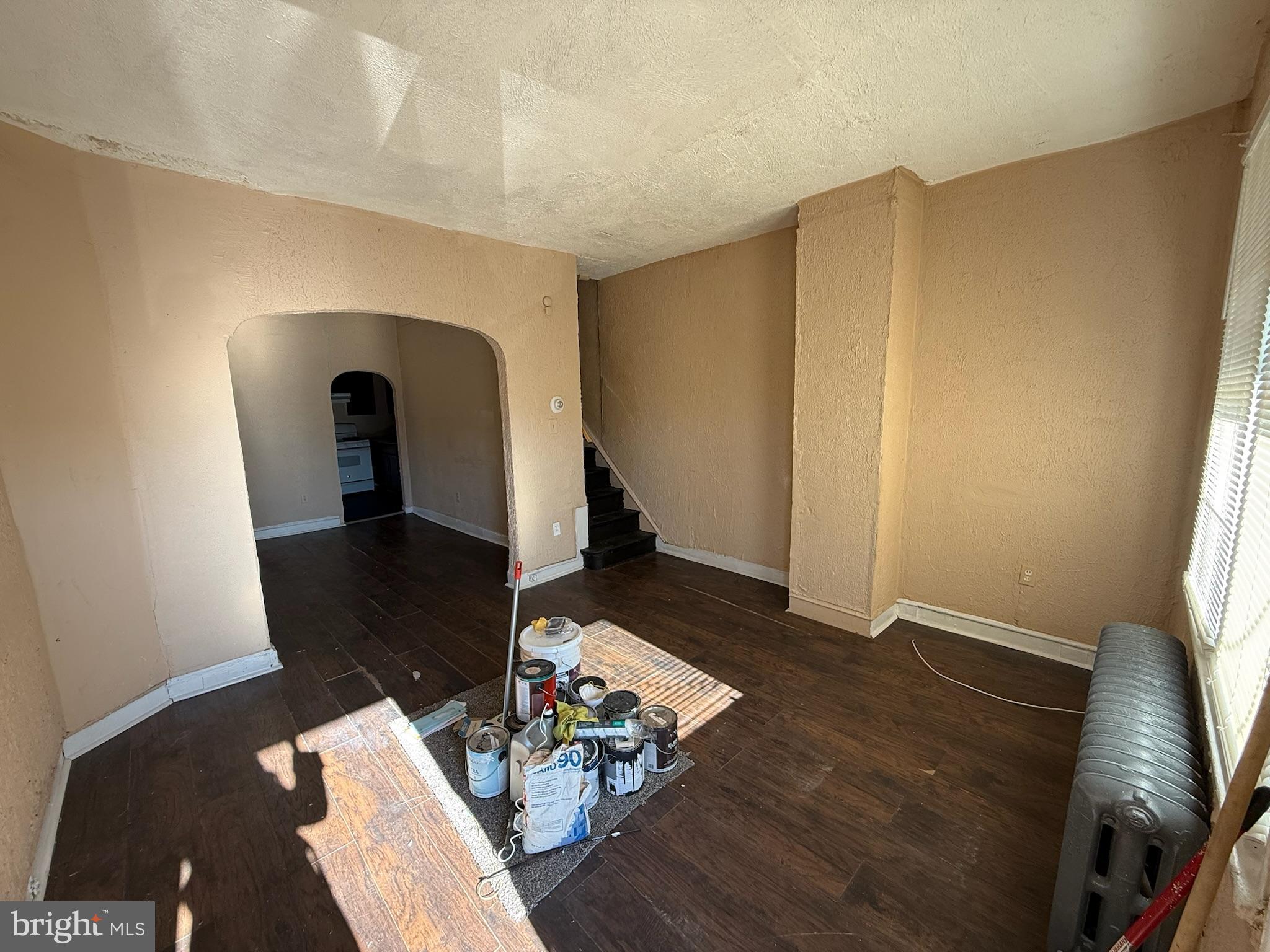 2413 West Indiana Avenue Philadelphia, PA 19132 - Photo 2 of 9 a living room with furniture and wooden floor