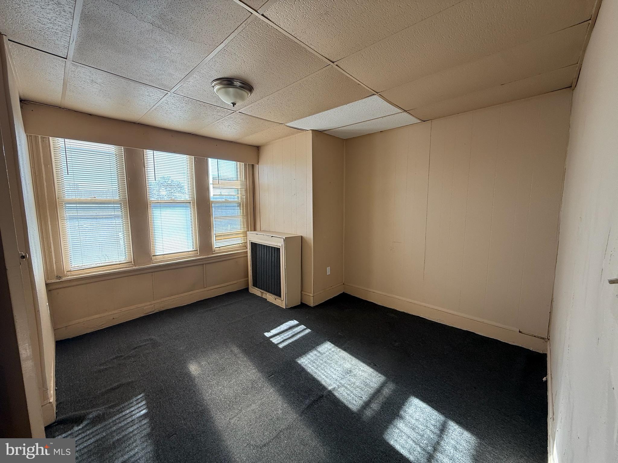 2413 West Indiana Avenue Philadelphia, PA 19132 - Photo 8 of 9 an empty room with windows