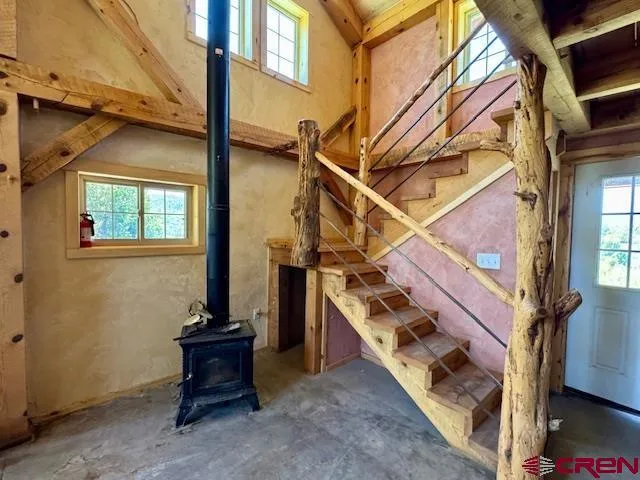 a view of a dining room with furniture and a flat screen tv