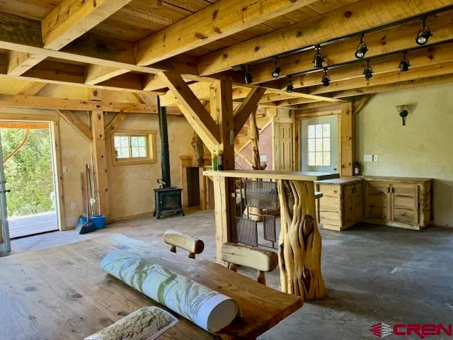 a bathroom with a toilet and a window