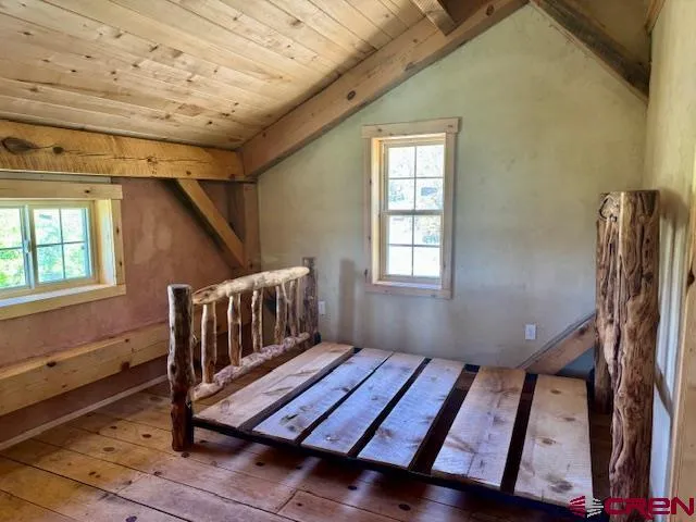 a bedroom with furniture and window