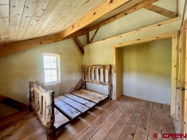 a view of a large mountain with mountains in the background