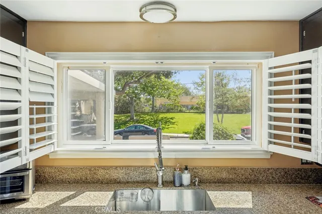 a view of a living room and a large window