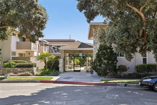 a room with cabinets and washer dryer