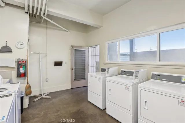 a view of a backyard with swimming pool and furniture