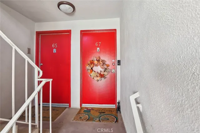 a view of hall way with furniture