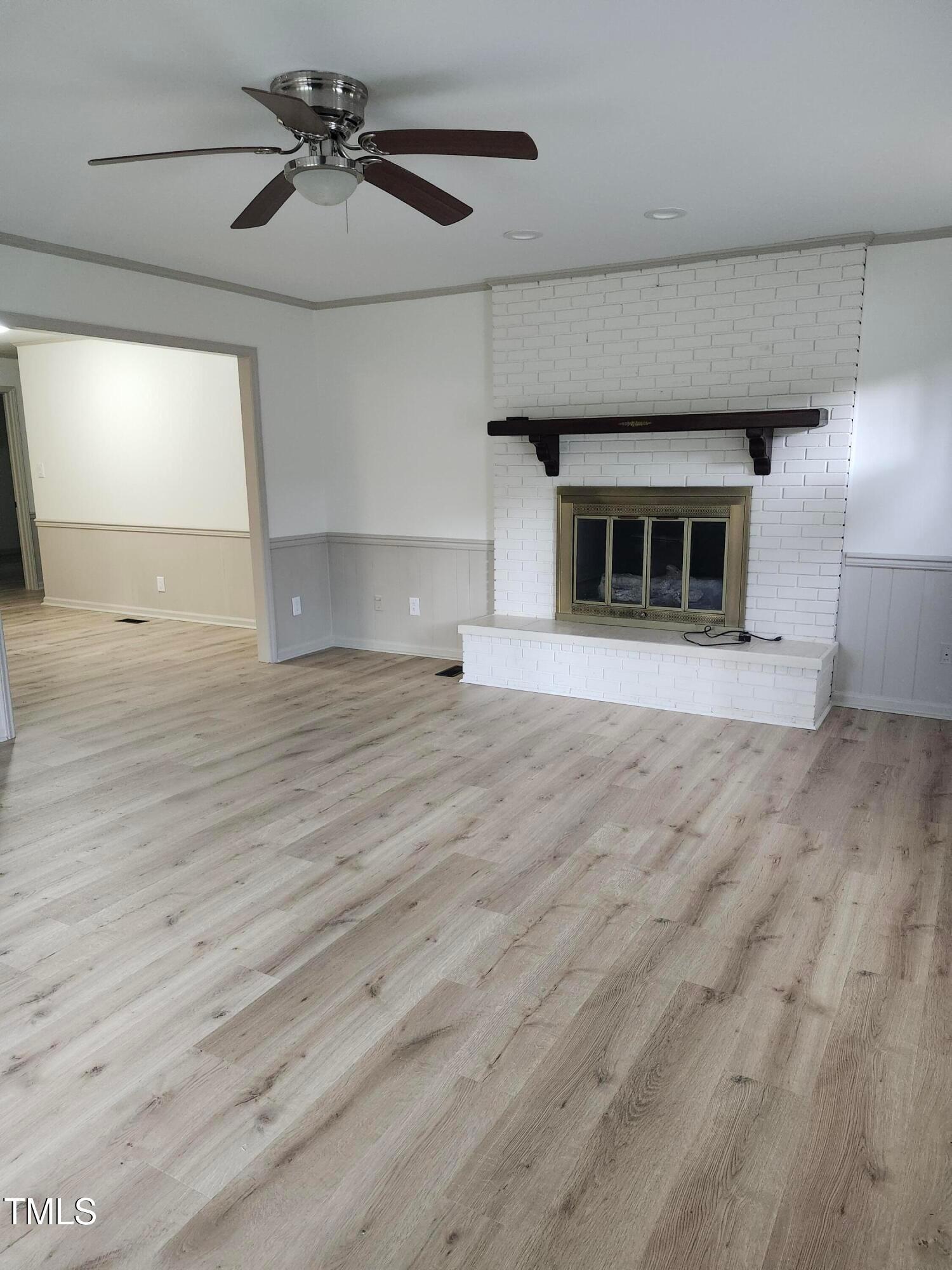 2546 Ardsley Drive Durham, NC 27704 - Photo 2 of 11 a view of an empty room with window and a kitchen