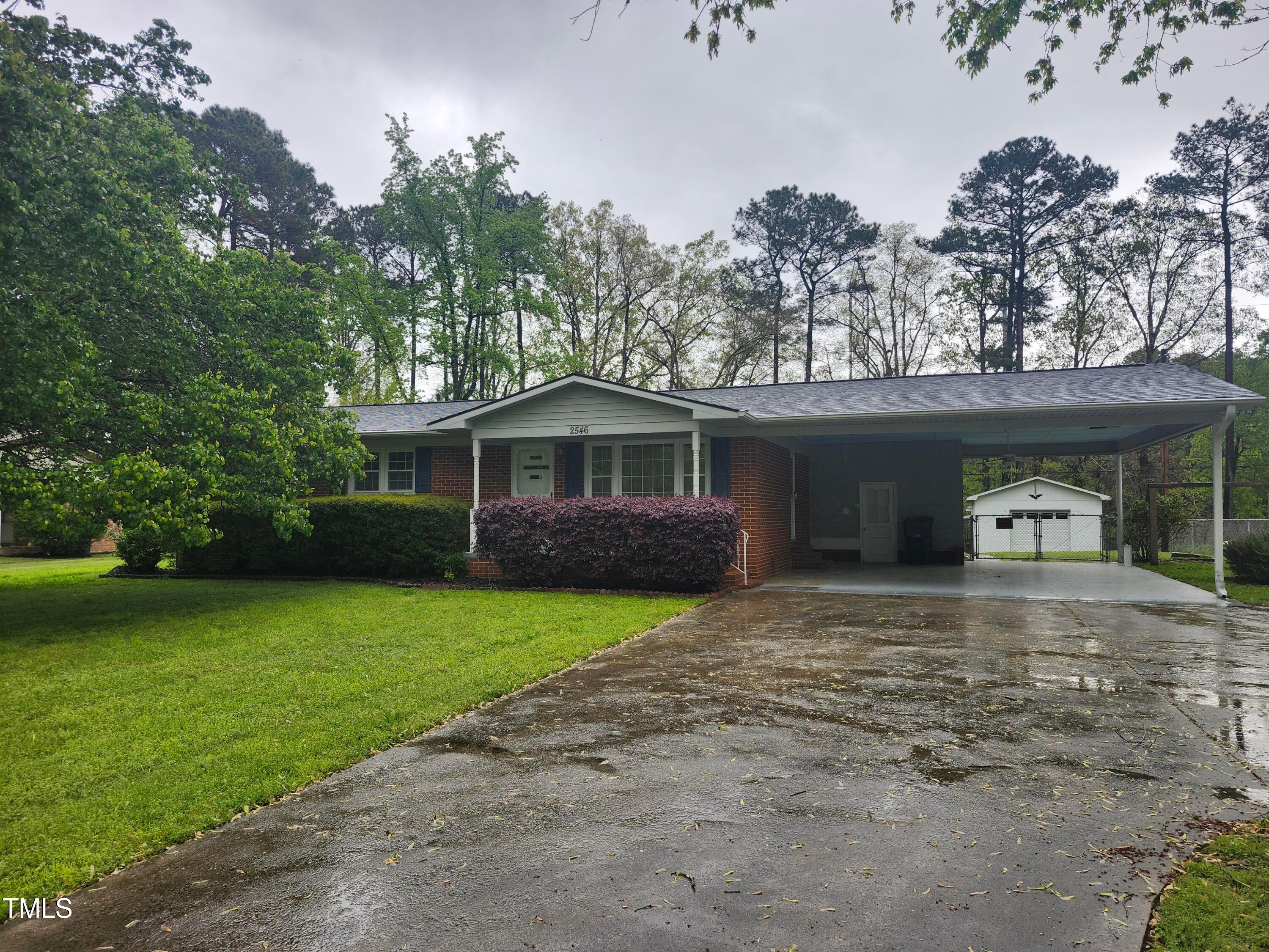 2546 Ardsley Drive Durham, NC 27704 - Photo 9 of 11 a front view of a house with a garden