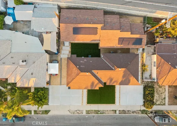 an aerial view of a house with a yard